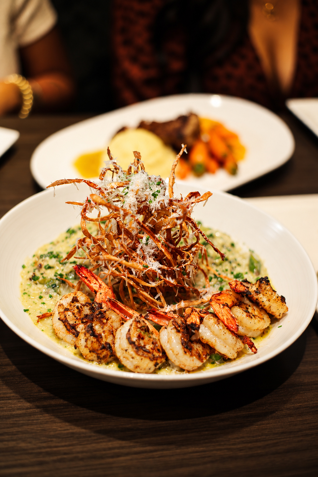 Shrimp and risotto topped with crispy shallots at Bar Bistro