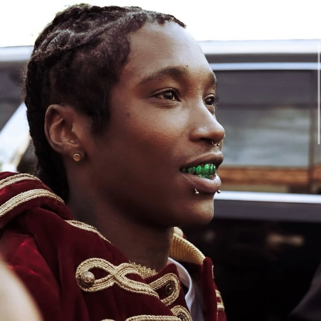 Nine Vicious wearing the green grillz