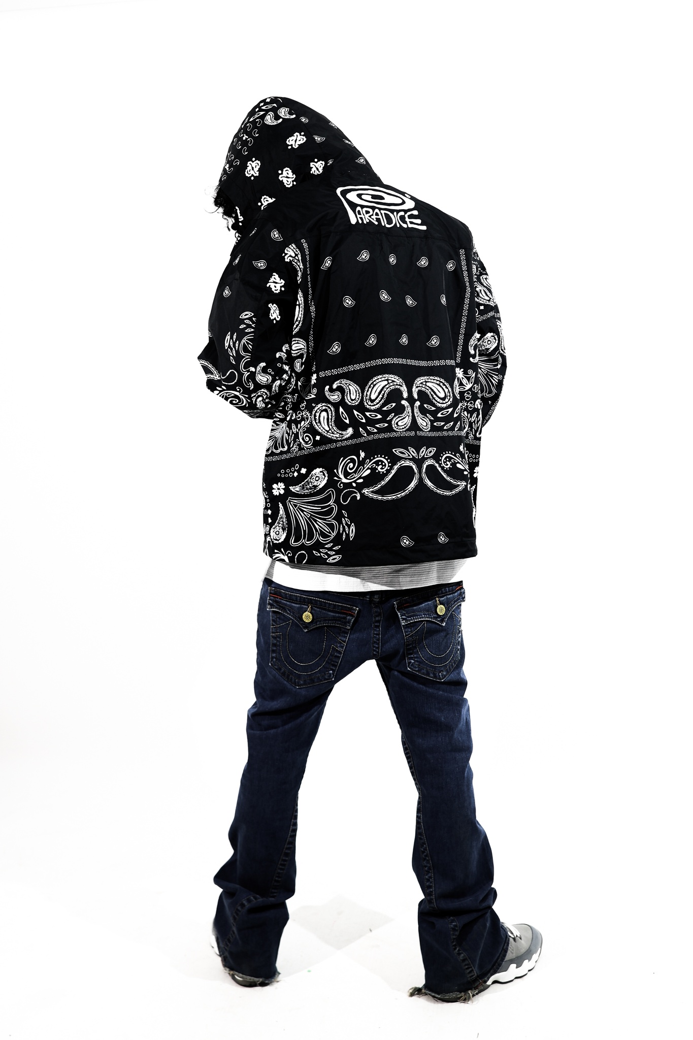 The back, with the PARADICE seal on the windbreaker