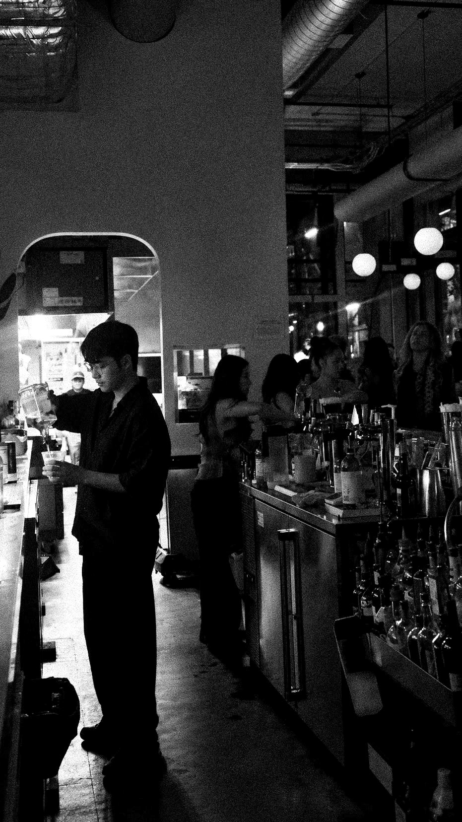 Behind the bar at Public House, Pioneer Square Seattle, black and white